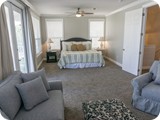 The Huge King master suite with walk out porch overlooking pool & seating area