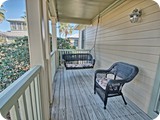 upstairs balcony with porch swing
